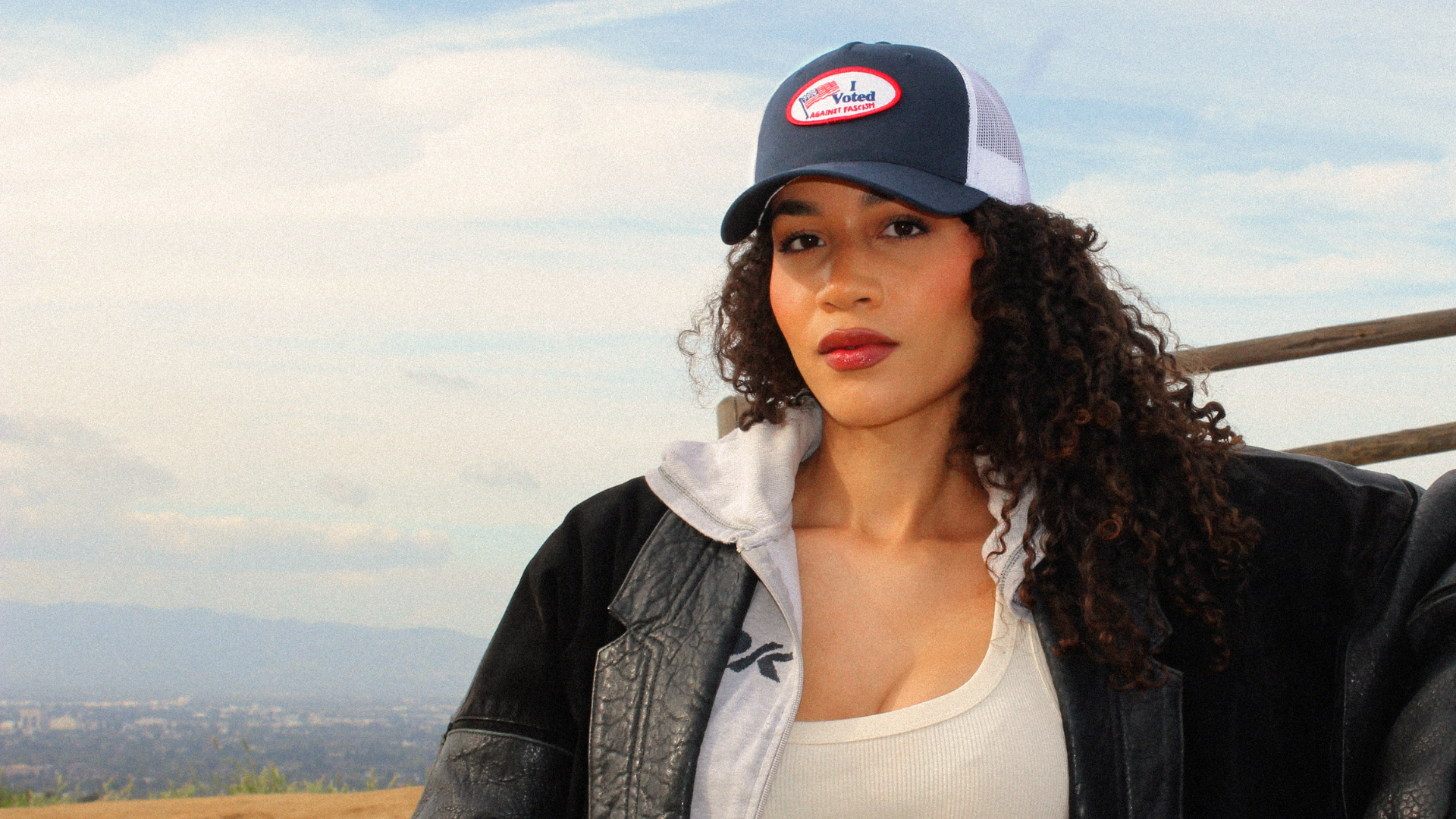 Activist wearing 404 Collective trucker hat — political streetwear brand Los Angeles